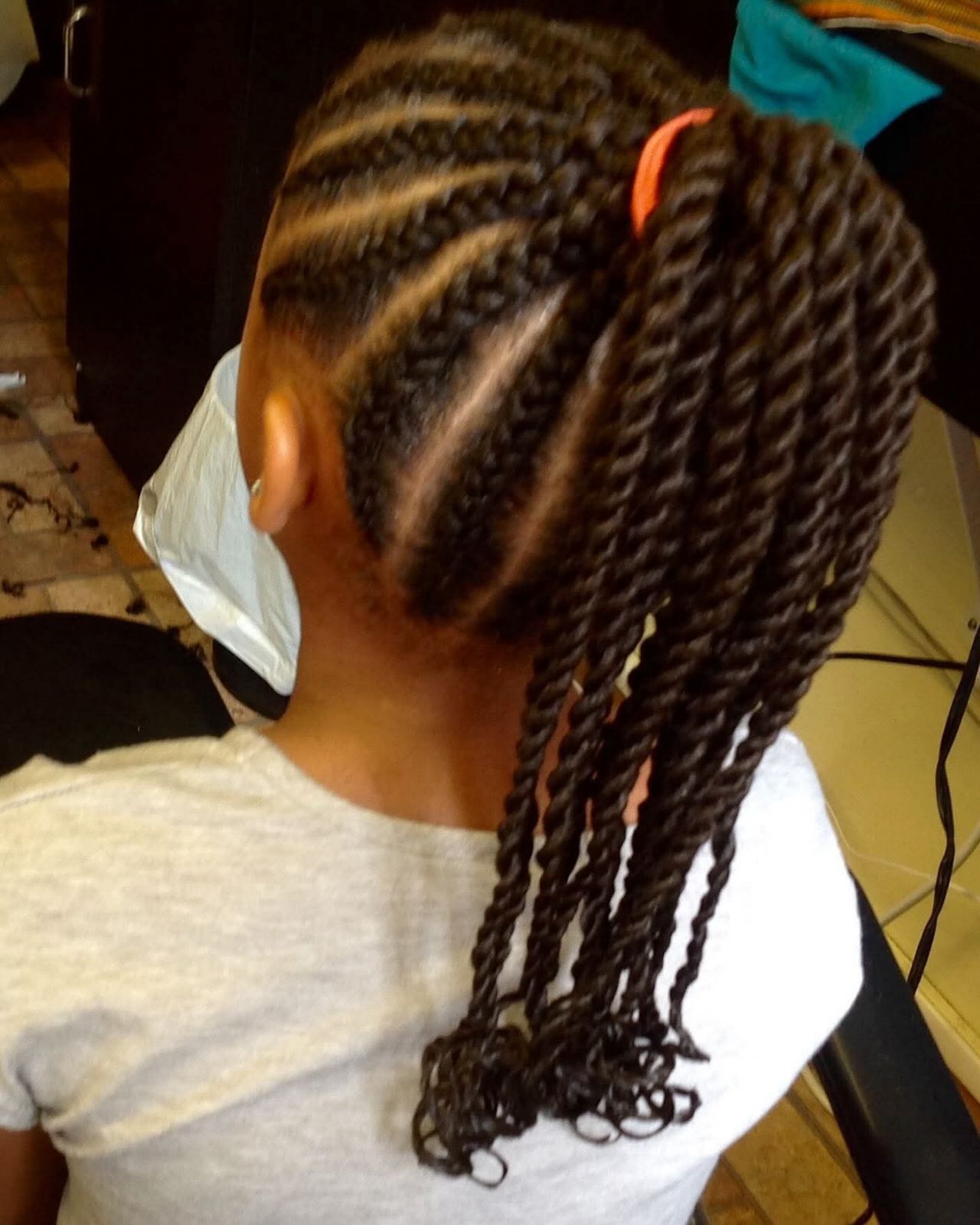 Styled twists in ponytail