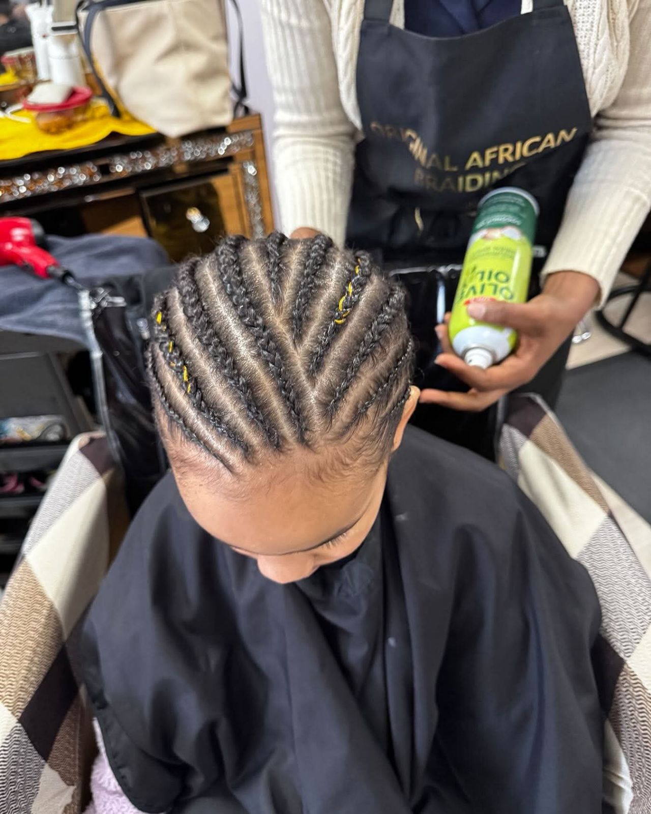 Child with braided hairstyle